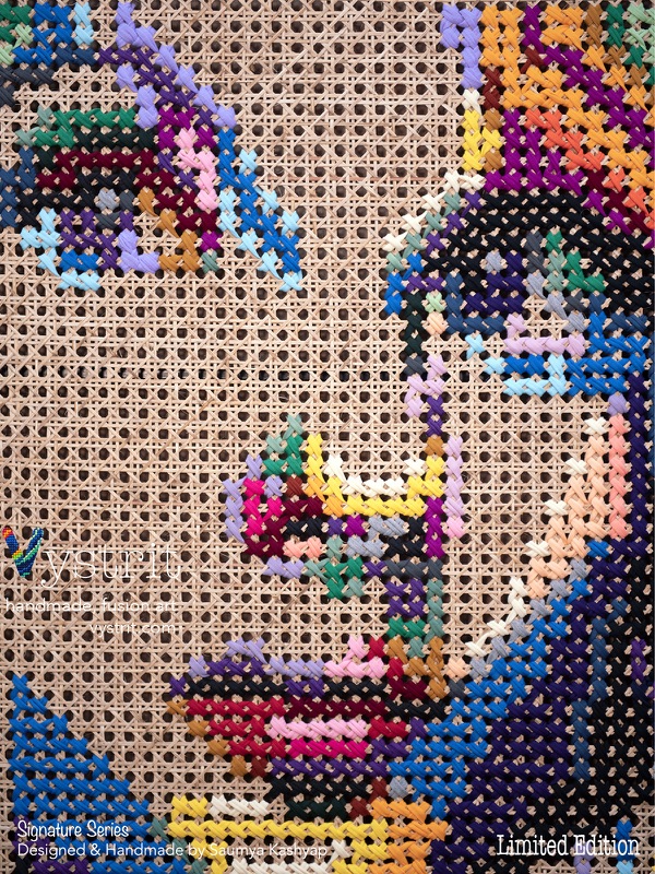 Detail of the face showing individual coloured stitches on cane